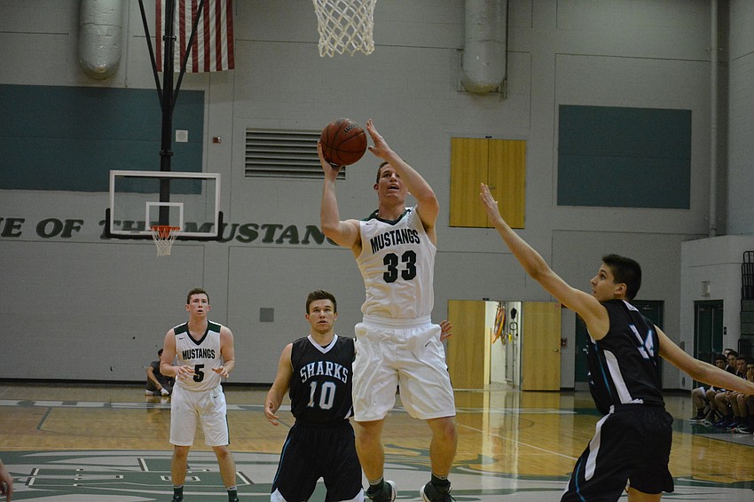 Justin Muscara adjusts for an inside shot.