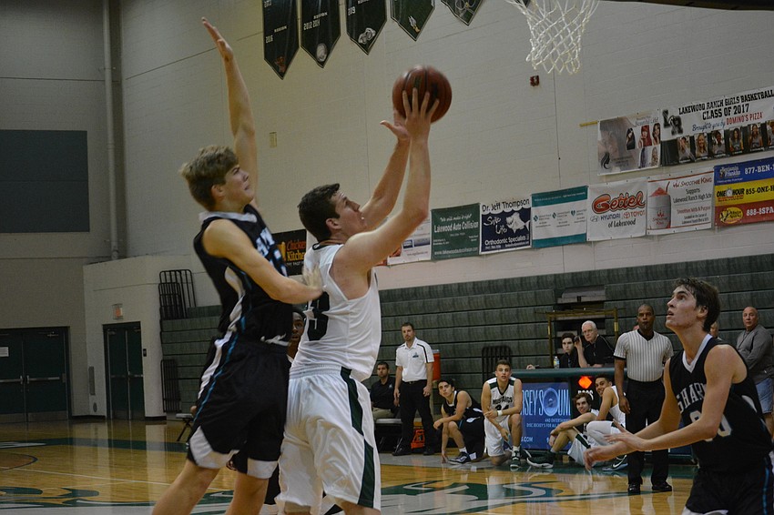 Justin Muscara gets past a Gulf Coast defender on the way to the hoop.