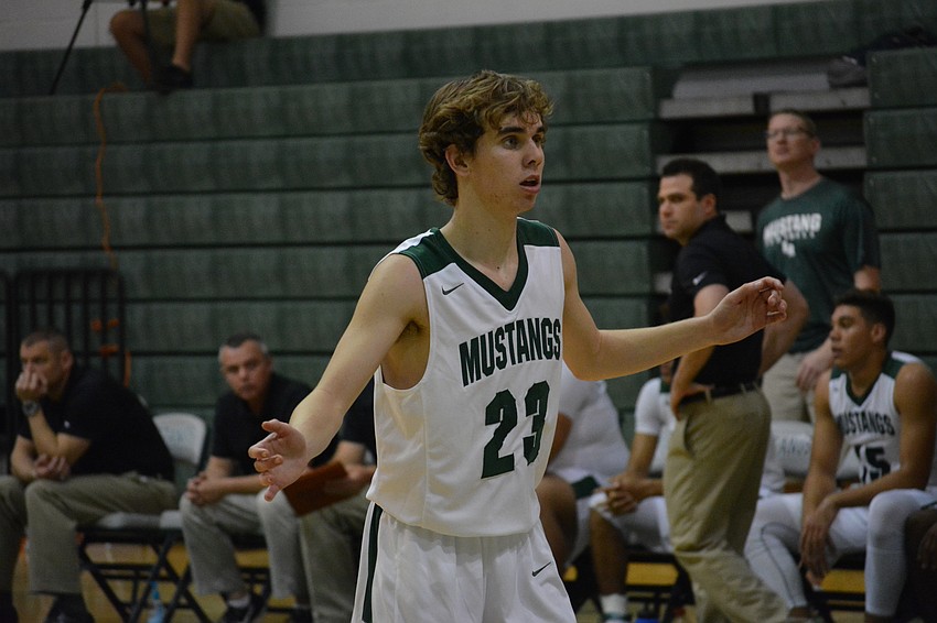 Brock Sisson guards an inbounds pass.
