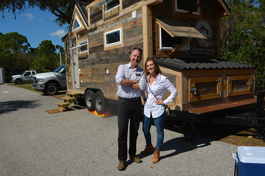 Jeffery Kin  and Michelle Bianchi-Pingel of The Players Centre check out the Tiny House at a special event at Willis Smith Construction.