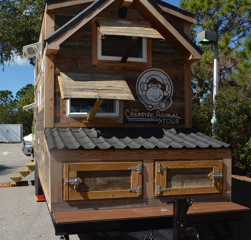 A couple of storage bins allow the couple to have somewhat of a wardrobe for changing seasons.