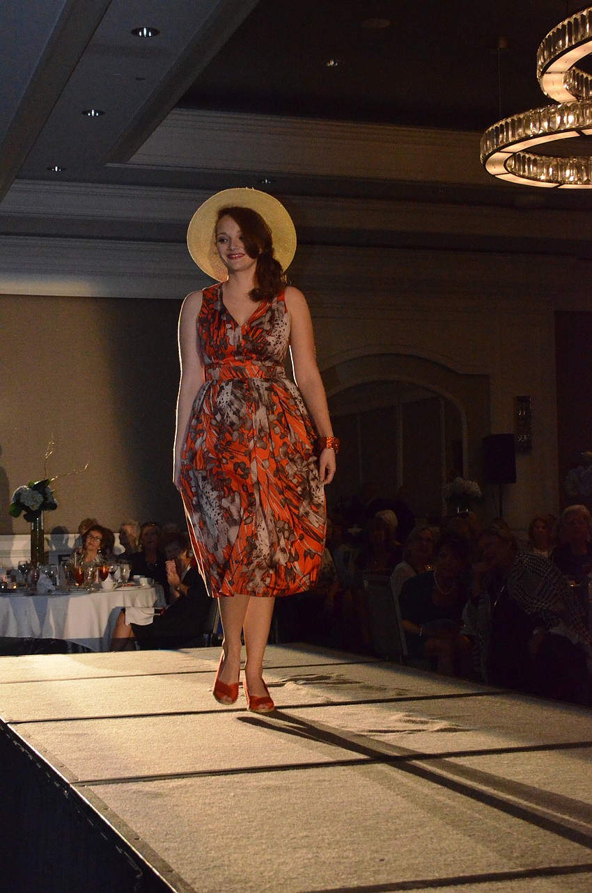 Laura Dykstra shows off an outfit from SPARCC'  s Treasure Chest during the fashion show at The Ritz-Carlton, Sarasota on Feb. 16.