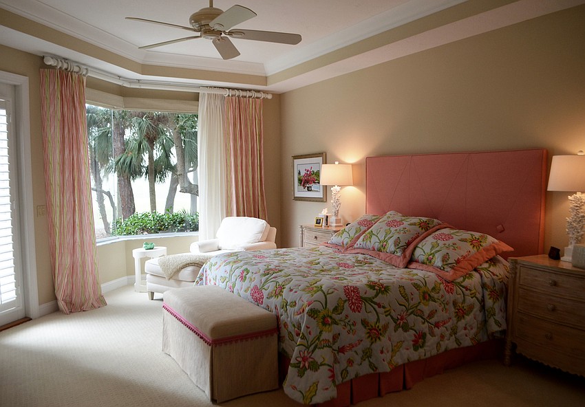 The master bedroom has simple but bright decor.