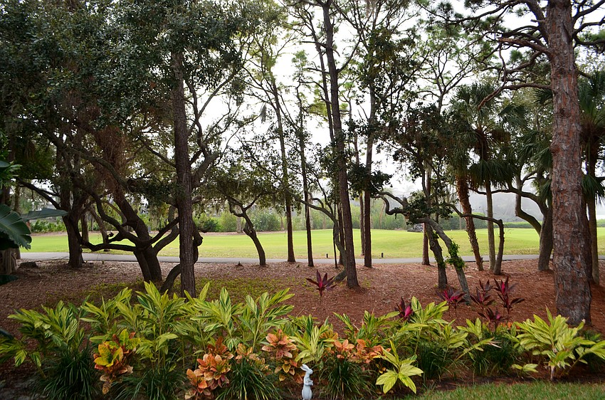 The home backs up to the fourth fairway of the Longboat Key Club Harbourside Golf Course.