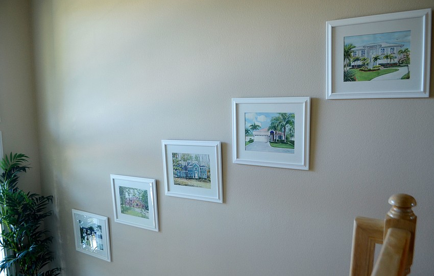 Pictures of Gurchieck’s previous homes line the main stairway.