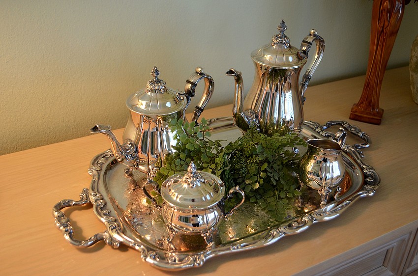 An old tea set rests on the dresser in the master bedroom.