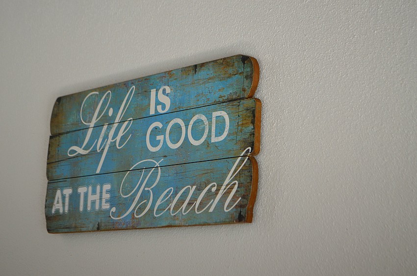 A sign on the pool deck even gives off the sand and sea theme.