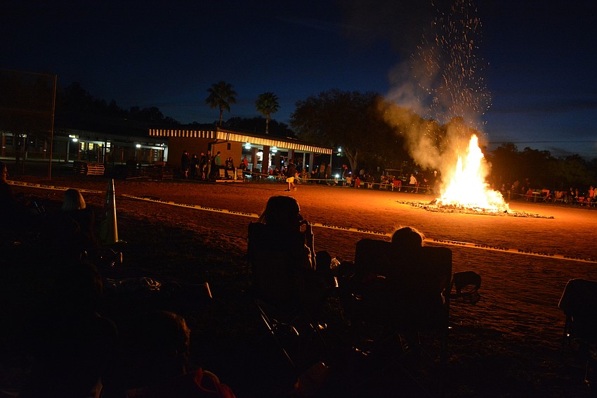 Firefighters kept bonfire attendees at a safe distance from the flames.
