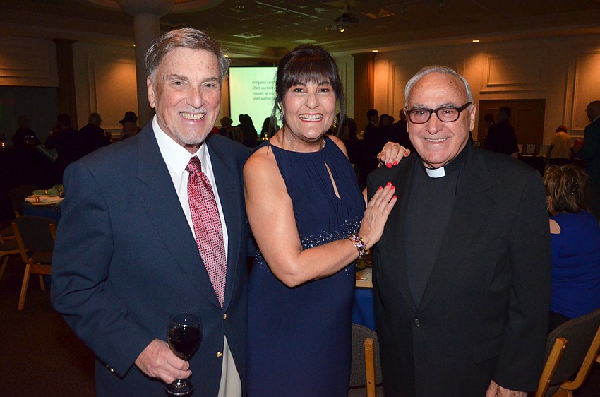 Mike Cetro, Co-Chairwoman Maricarmen Vazmina and Father Celestino Gutierres