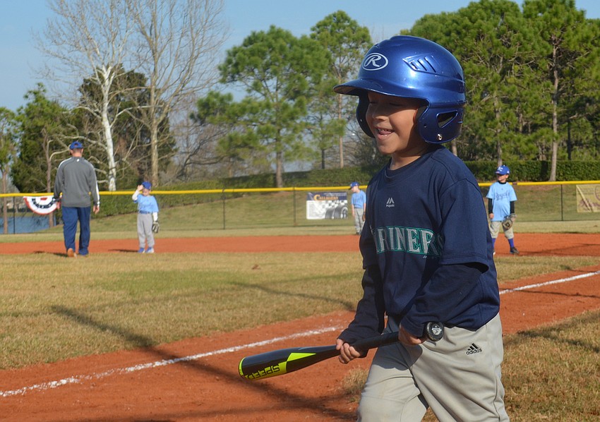 The Mariners'    Christopher Mitchell obviously is happy it'   s opening day.