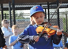 The Blue Jays'    Brody Rose, also a member of the Sarasota Youth Orchestra, plays the Star Spangled Banner.