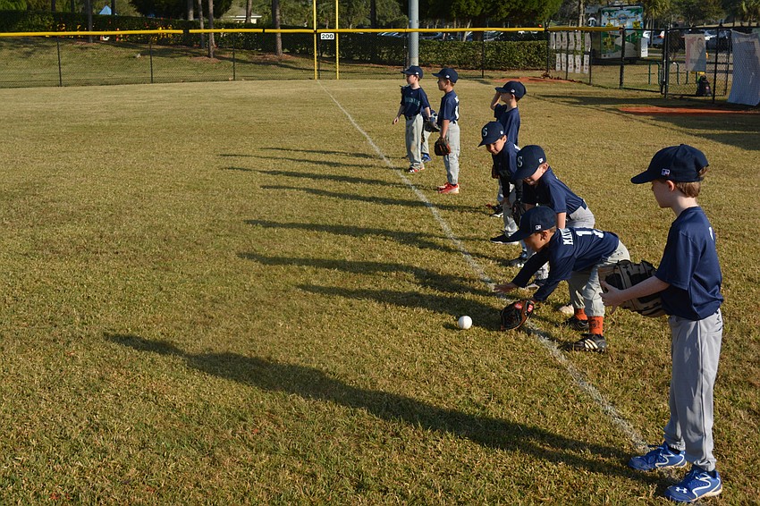 The Mariners go through warm-ups before the opener.