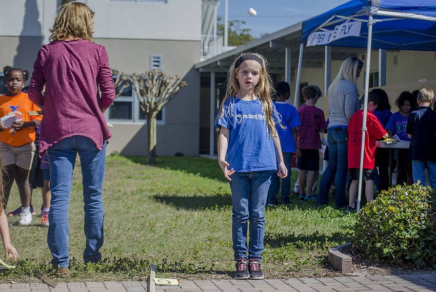 Emma Passifiume throws a cotton ball during the shot-put portion of the Measurement Olympics.