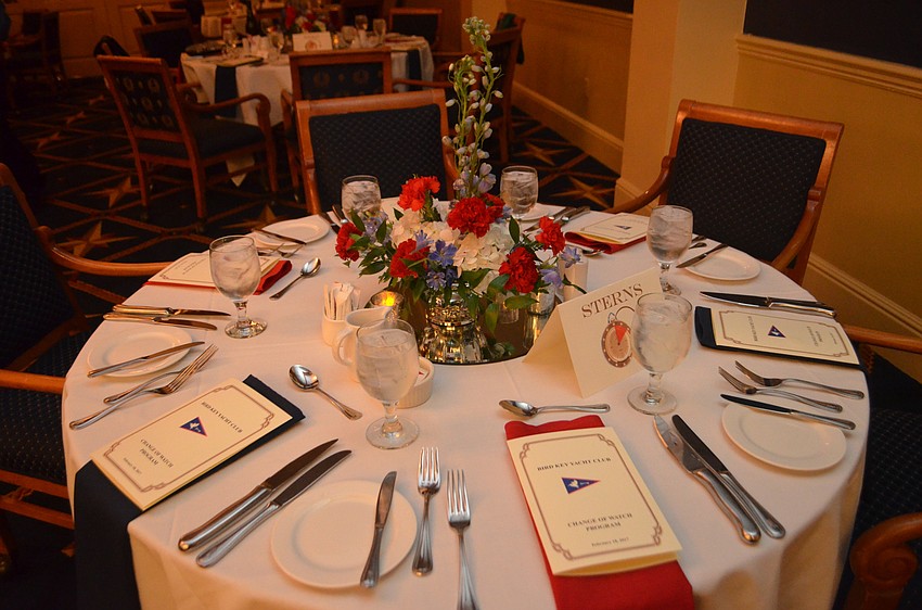 Flower arrangements decorated each table.