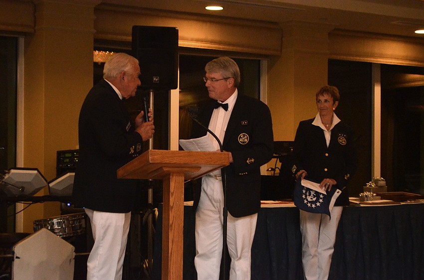 Marty Cooper swears in Charlie Wilson as the new commodore.