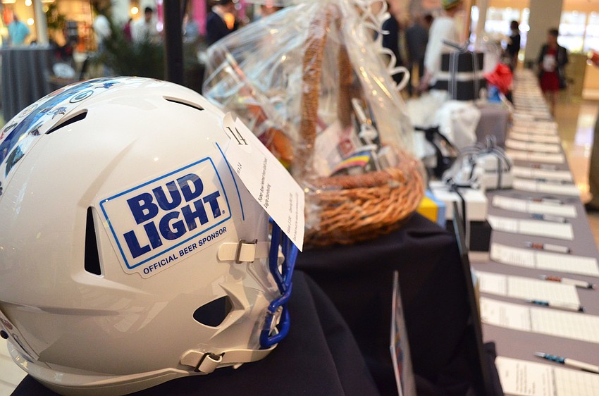 Silent auction items ranged from tickets to productions by nearly every local theatre company to a Bud Light Super Bowl helmet from Gold Coast Eagle Distributing at iconcept 2017 on Feb. 19 at Saks Fifth Avenue.