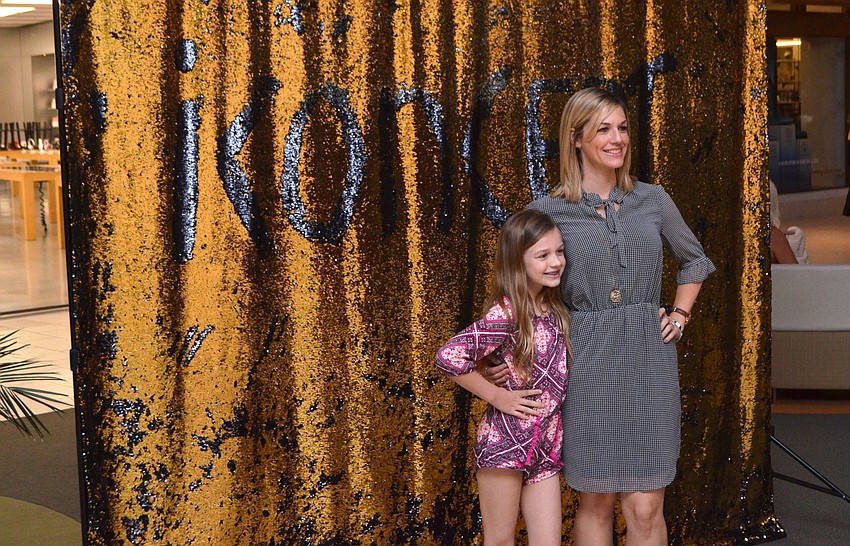 Taylor Snelling and her mom, Nicole Snelling, get their photo taken at the photo booth.