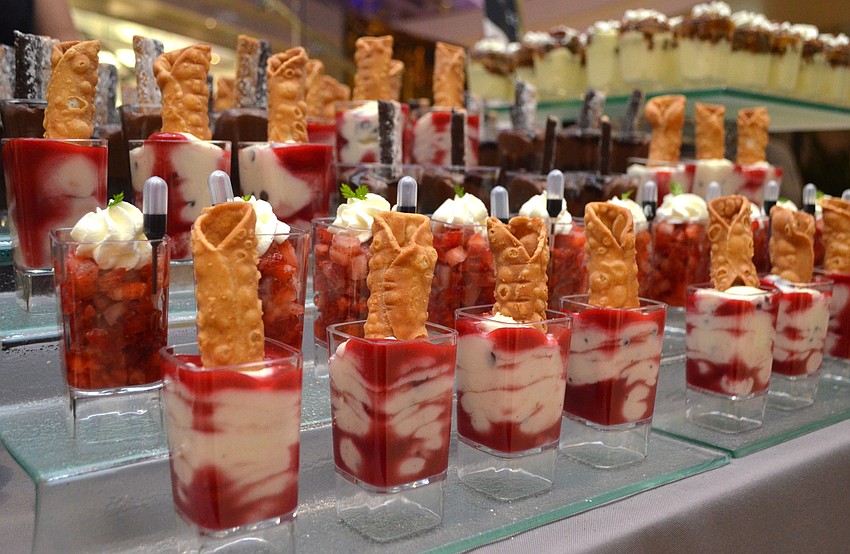 Guests munched on several “mini indulgences” by Season 52 such as these raspberry chocolate chip cannolis and Plant City strawberries with pepper glaze and balsamic pipette.
