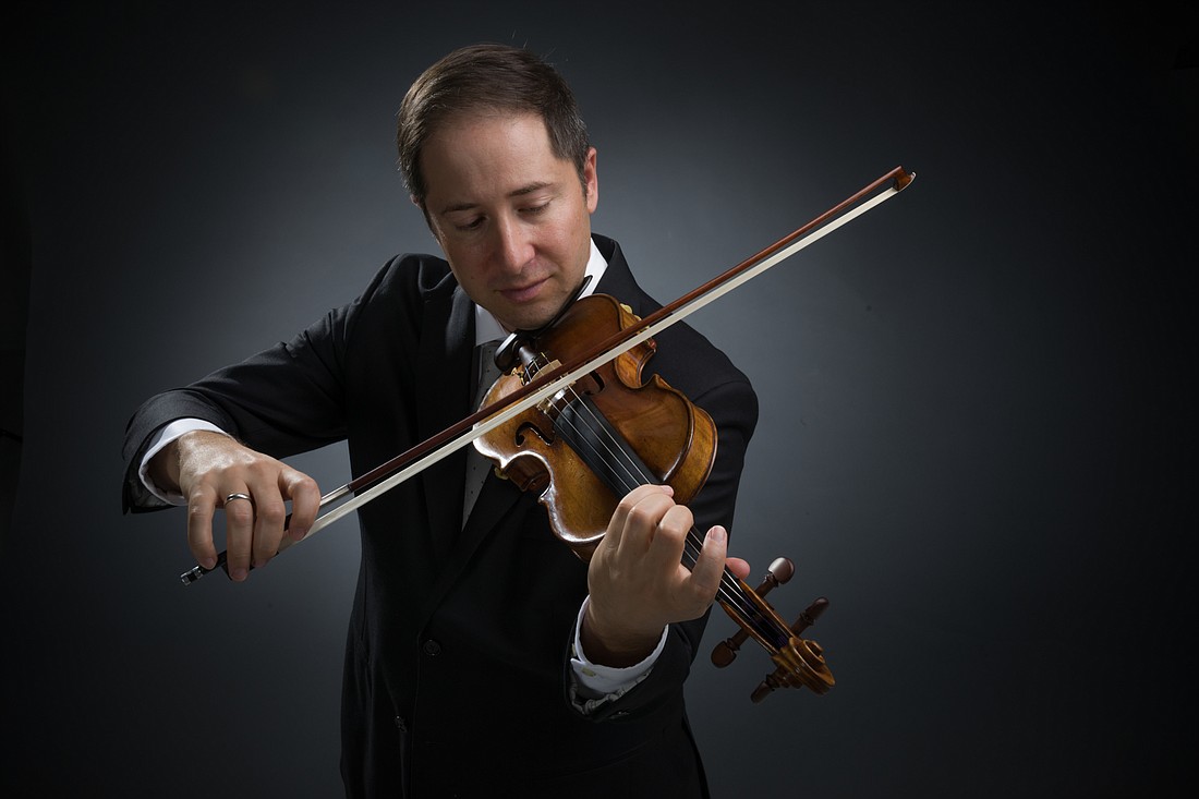 Dan Jordan with the 1695 ex Humphreys Guarneri, named after Sydney Humphreys, the violinist who last played the rare instrument. The two never met, but Jordan says he feels connected to him. Courtesy photo.