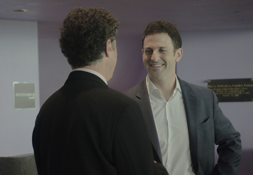 Lee Mirman speaks with Jared Cohen after his lecture.