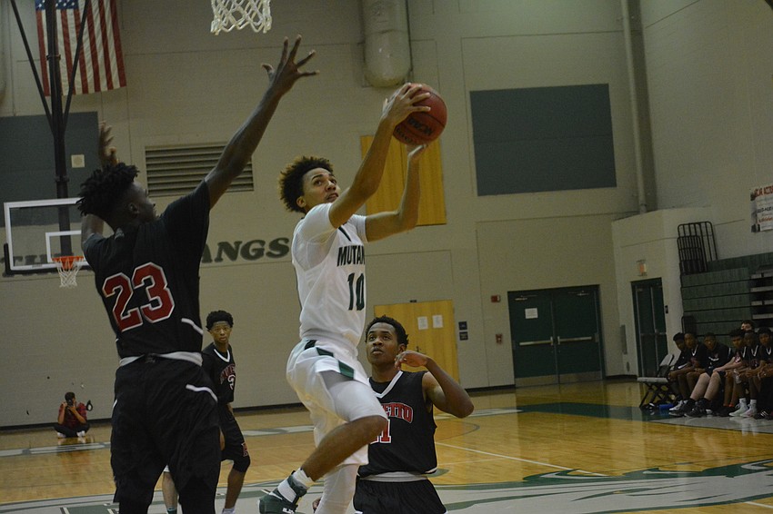 Devin Gordon skies for a layup.