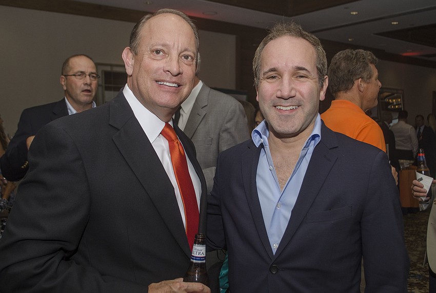 President of the Economic Development Corporation of Sarasota County Mark Huey and Orioles Executive Vice President John Angelos.