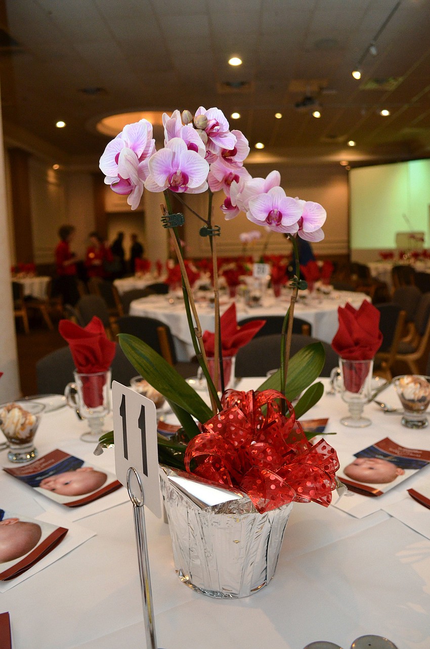 The orchid centerpieces were sold for $20 a piece to benefit Mothers and Infants.