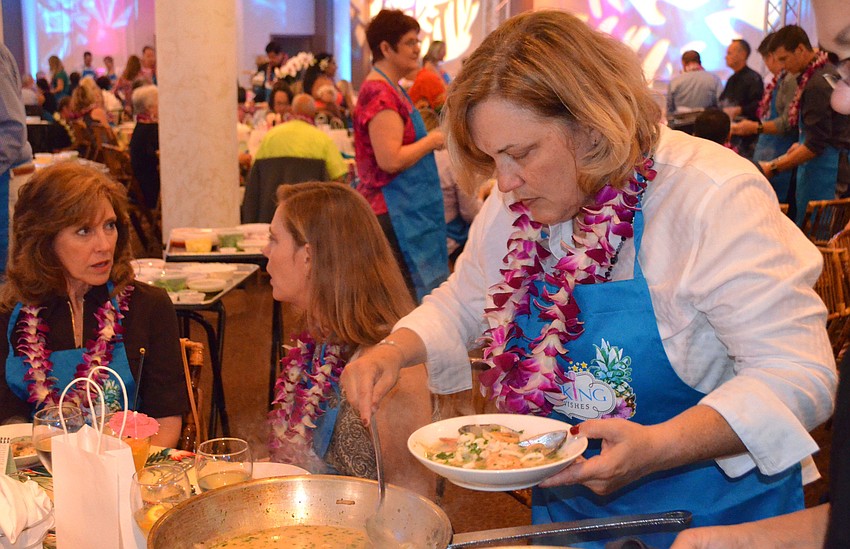 Fran Johnson prepares the first course for her table.