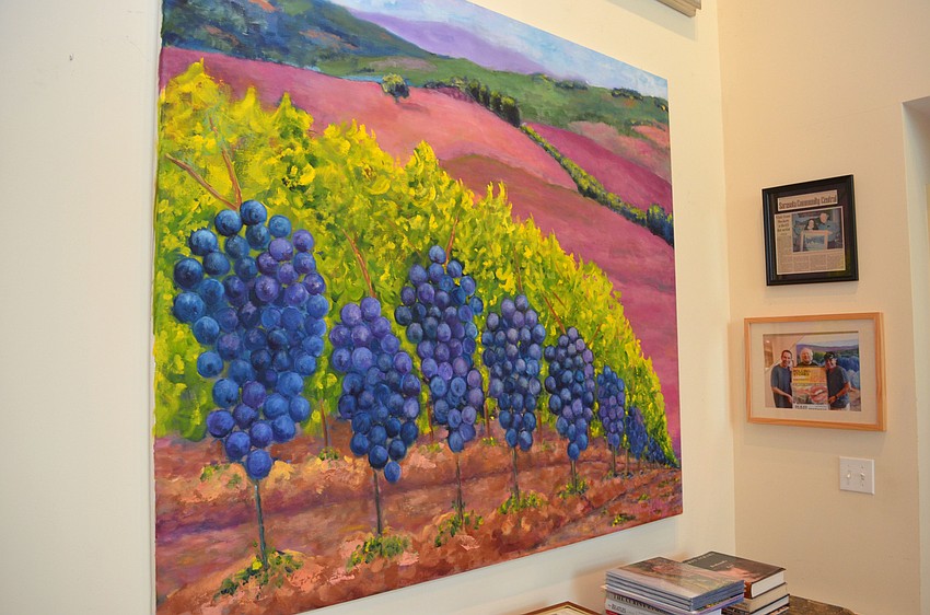 “L’Uva Sangiovese di Montalcino,” a 60’ x 68’ oil on canvas painting that Kelley produced two years ago after visiting Caparzo Vineyard in Montalcino, Italy. Bids for the original piece start at $25,000.