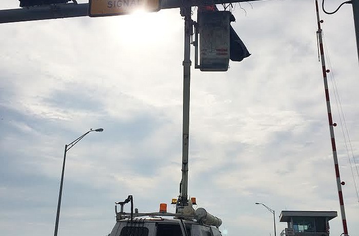 On Tuesday, Feb. 21, work crews removed the next on the New Pass Bridge, as transportation officials said it obscured the bridge signal.