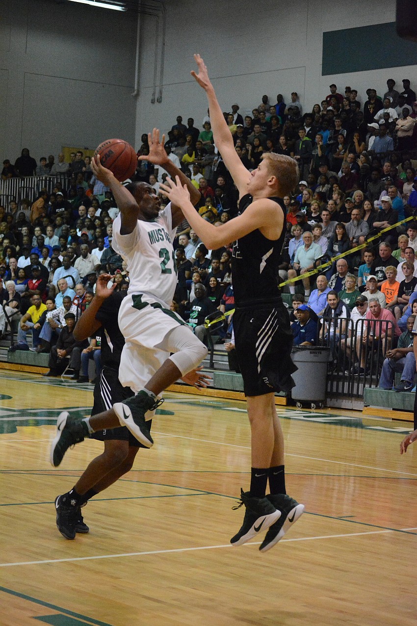 Devin Twenty drives to the hoop.