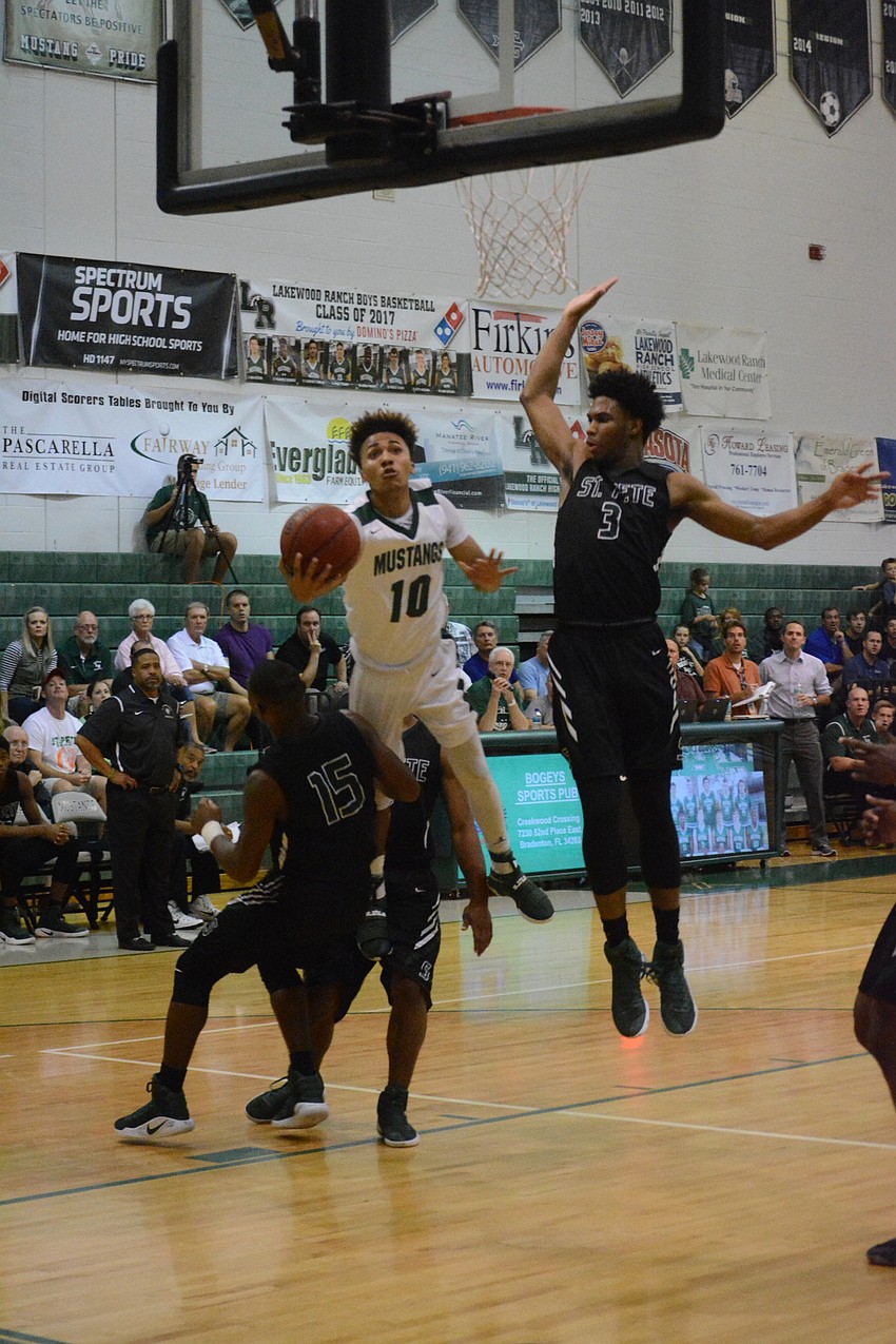 Damien Gordon hits a falling shot from the baseline.