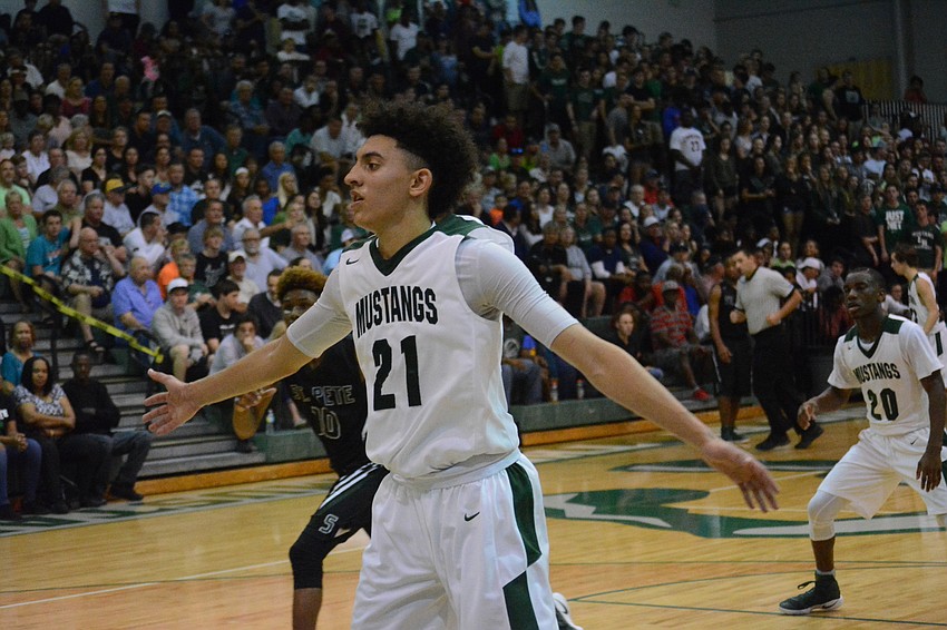 Evan Spiller closely guards an inbounds pass.
