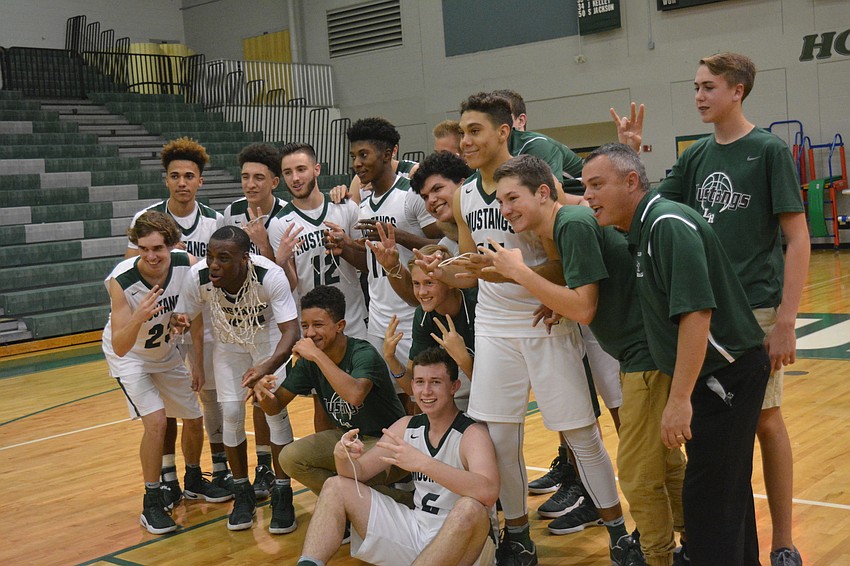 The Mustangs strike a Final Four pose.