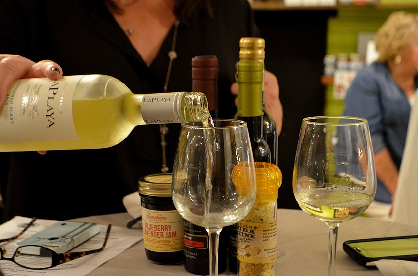 Guests taste La Playa sauvignon blanc.