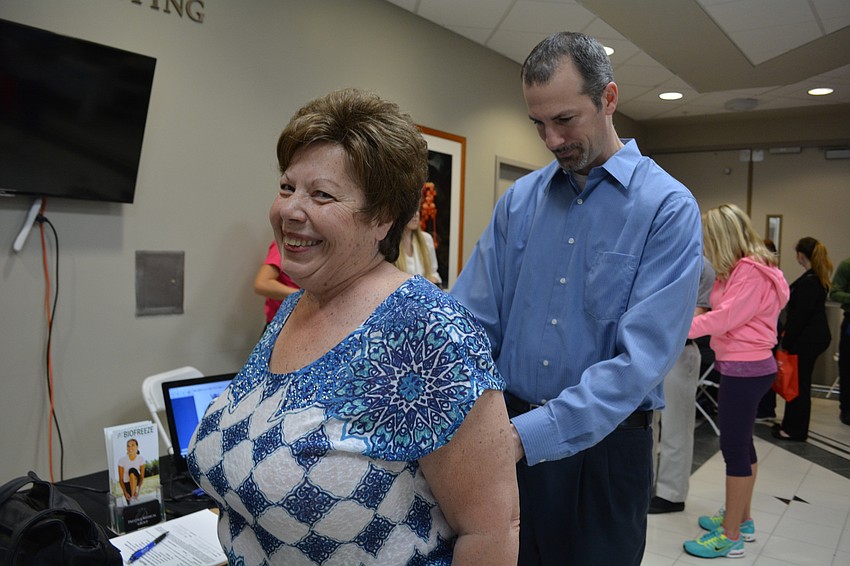 Louise Weglarz, of Bradenton, gets her back checked by Dr. Timothy Jay, of Prestige Medical Group.