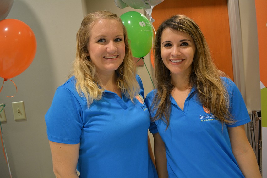 Carrie Doxey and Jessica Obester promote Braine Balance Achievement Centers.