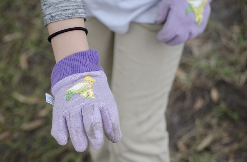 Savanah Montes shows off her Tinker Bell work gloves.