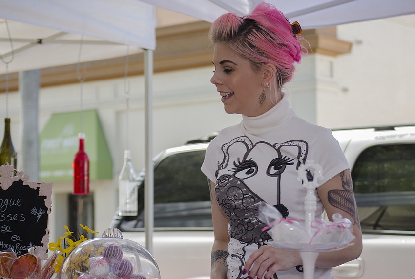 Virginia Hughes speaks to a customer.