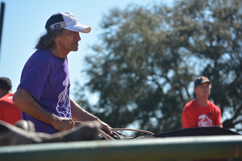 Lucio Amerigo Gomez awaits his turn at roping a steer.