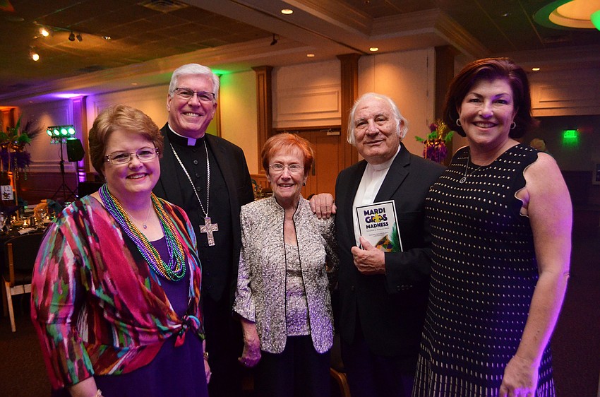 Event chairwoman Terri Maze, Bishop Frank Dewane, Jeanne Hickey, the Rev. Fausto Stampiglia and Program Director Colleen McMenamin