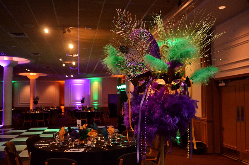 The Michael’s on East Ballroom was decorated with Mardi Gras masks and hues of purple and green on Feb. 25 for the Bethesda House of Catholic Charities Mardi Gras Madness.