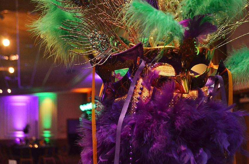 The Michael’s on East Ballroom was decorated with Mardi Gras masks and hues of purple and green on Feb. 25 for the Bethesda House of Catholic Charities Mardi Gras Madness.