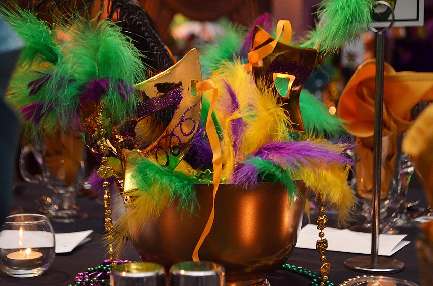 The Michael’s on East Ballroom was decorated with Mardi Gras masks and hues of purple and green on Feb. 25 for the Bethesda House of Catholic Charities Mardi Gras Madness.