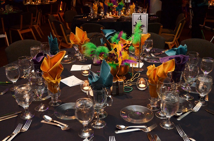 The Michael’s on East Ballroom was decorated with Mardi Gras masks and hues of purple and green on Feb. 25 for the Bethesda House of Catholic Charities Mardi Gras Madness.