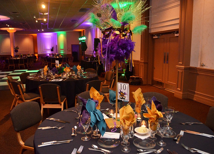 The Michael’s on East Ballroom was decorated with Mardi Gras masks and hues of purple and green on Feb. 25 for the Bethesda House of Catholic Charities Mardi Gras Madness.