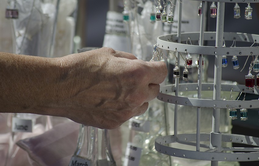 Festivalgoers perused a variety of custom jewelry and crafts.