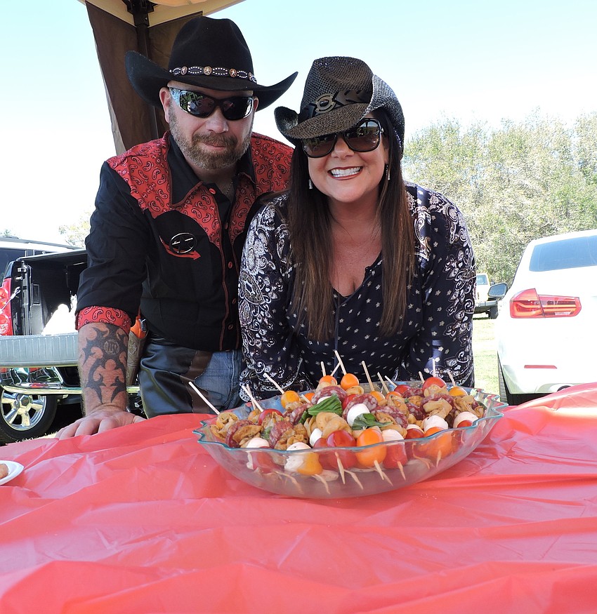 Ray Shepherd and Kim Gennocro of Lakewood Ranch get ready to enjoy some Shish kebab before the Observer Cup.