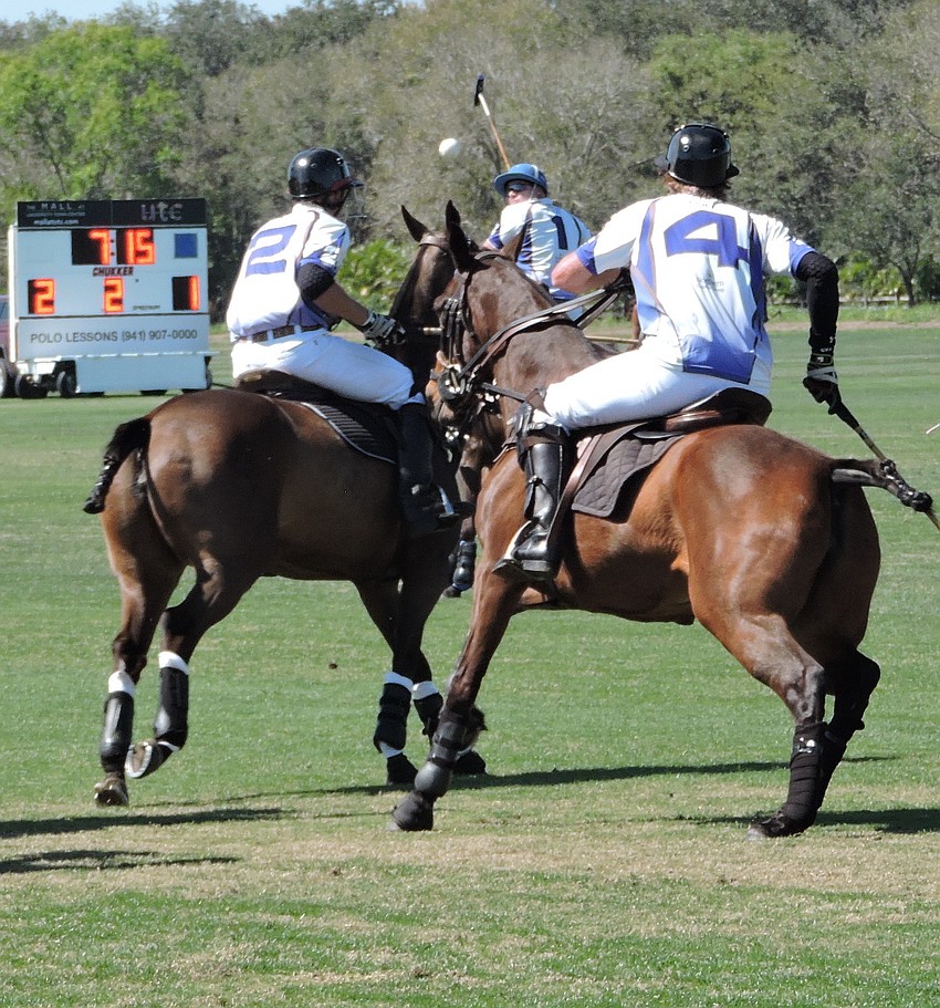 Tito'  s Buck Schott, Ryan Gilbertson and Joe Wayne Barry surround the ball during the Observer Cup.