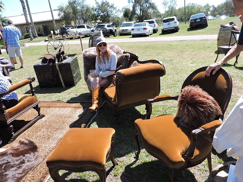 Sarasota'  s Karlenn Peluso enjoys the Western bordello furniture provided by So Staged.